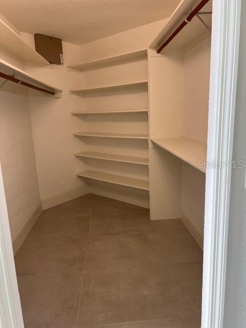 2800 Conway Gardens Road Orlando, FL 32806 - Photo 12 of 23 a view of walk in closet with empty racks