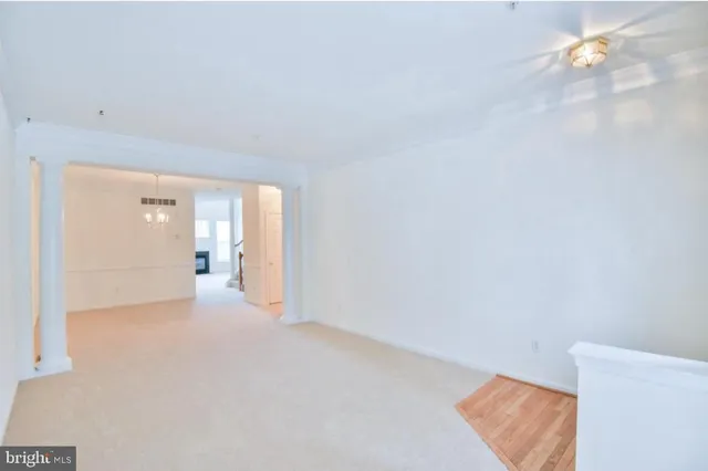 a view of a room with a hallway