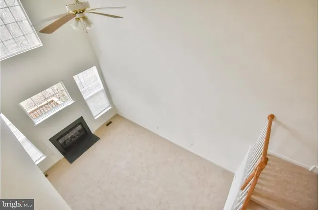 a view of a living room with a fireplace