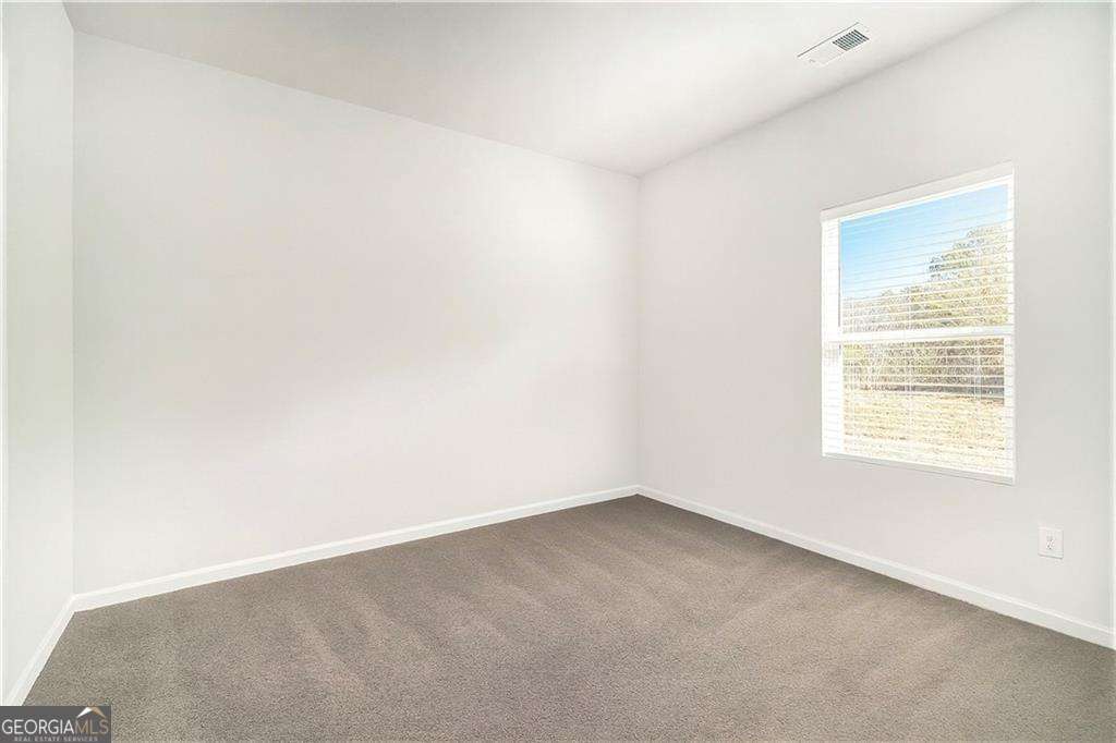 1101 Longleaf Trace Monroe, GA 30656 - Photo 18 of 36 an empty room with a window