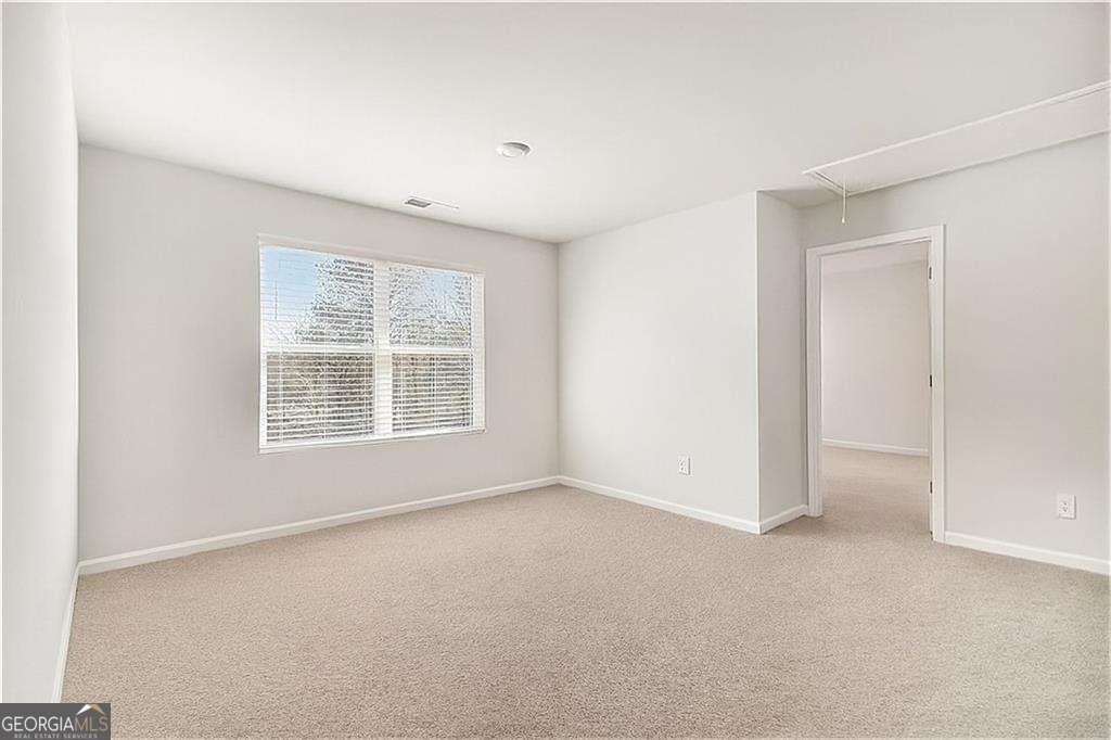 1101 Longleaf Trace Monroe, GA 30656 - Photo 20 of 36 a view of an empty room with a window