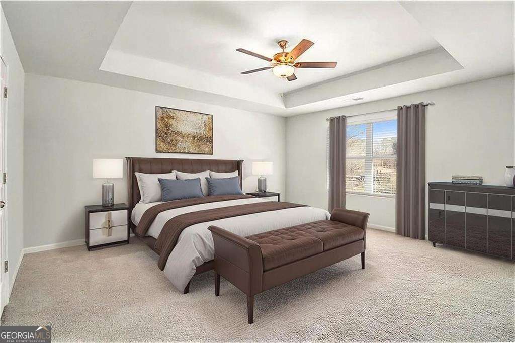 1101 Longleaf Trace Monroe, GA 30656 - Photo 22 of 36 a spacious bedroom with a large bed and a chandelier