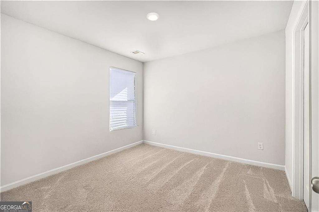 1101 Longleaf Trace Monroe, GA 30656 - Photo 28 of 36 a view of an empty room with a window