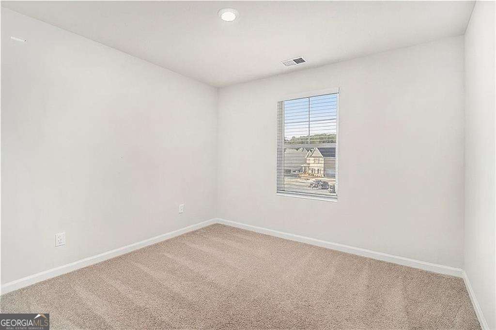 1101 Longleaf Trace Monroe, GA 30656 - Photo 30 of 36 an empty room with a window