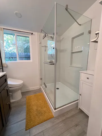 a bathroom with a tub and a shower