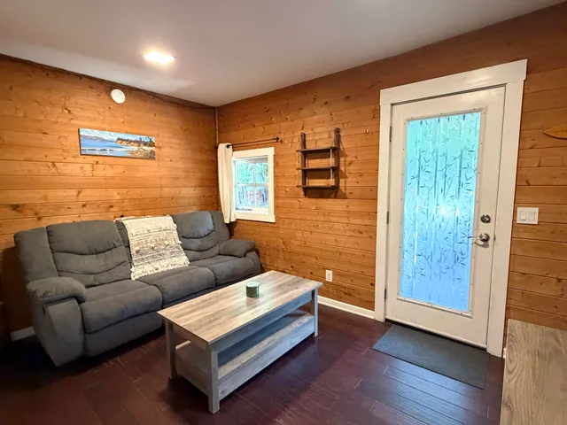 a bedroom with furniture and wooden floor