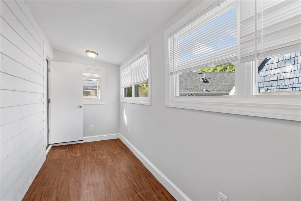 48 High Street, Unit 48 Somerville, MA 02144 - Photo 14 of 23 a view of small space with wooden floor and a window