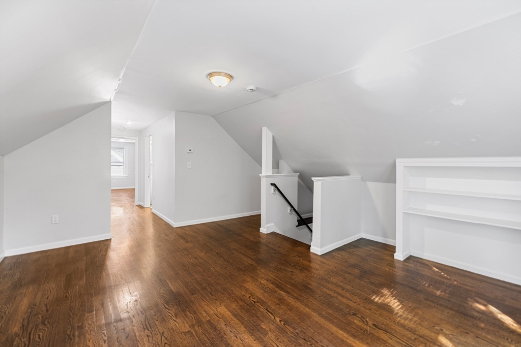 48 High Street, Unit 48 Somerville, MA 02144 - Photo 16 of 23 a view of an empty room with wooden floor