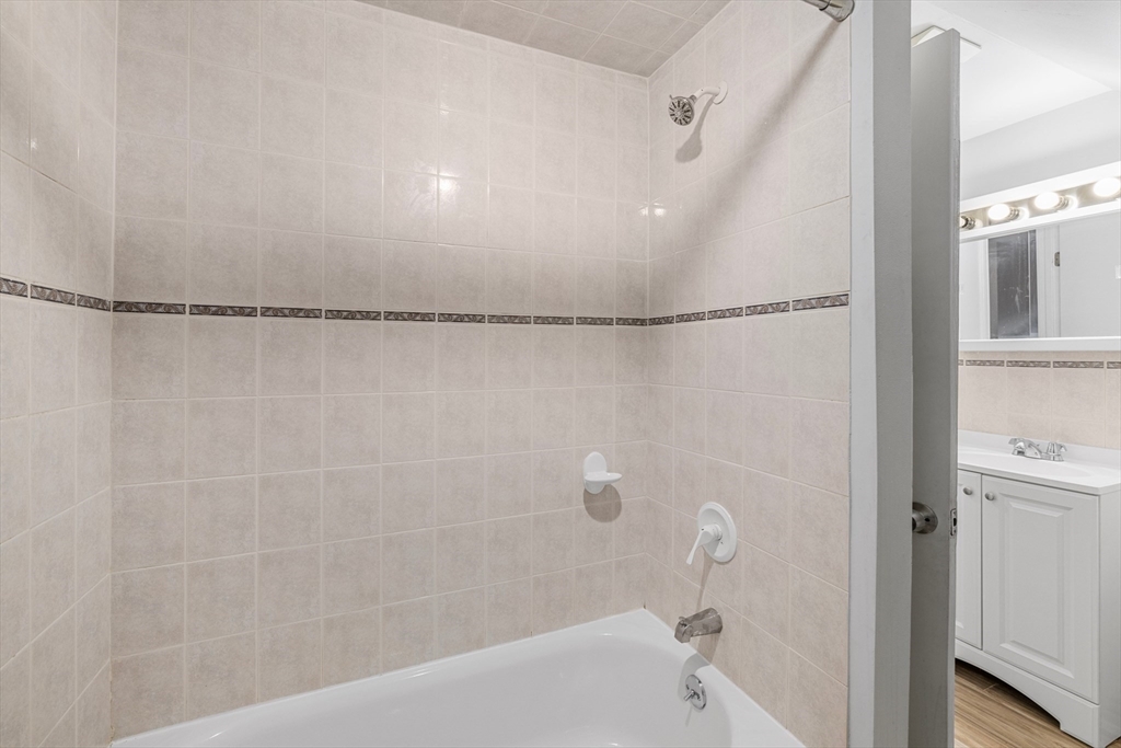 48 High Street, Unit 48 Somerville, MA 02144 - Photo 20 of 23 a bathroom with a bathtub and a shower