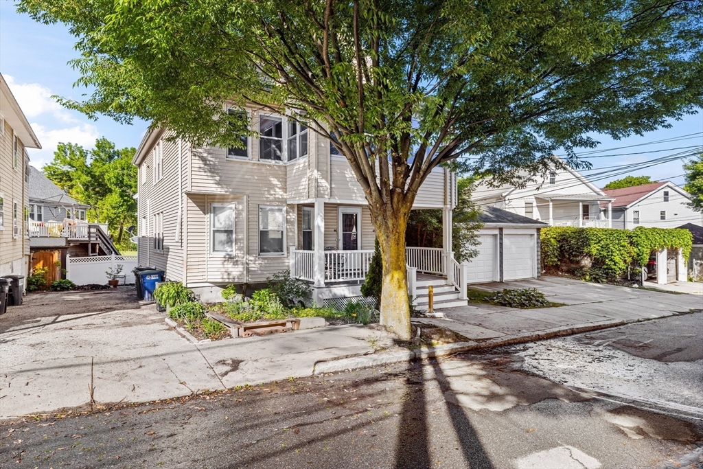 48 High Street, Unit 48 Somerville, MA 02144 - Photo 23 of 23 a front view of a house with garden