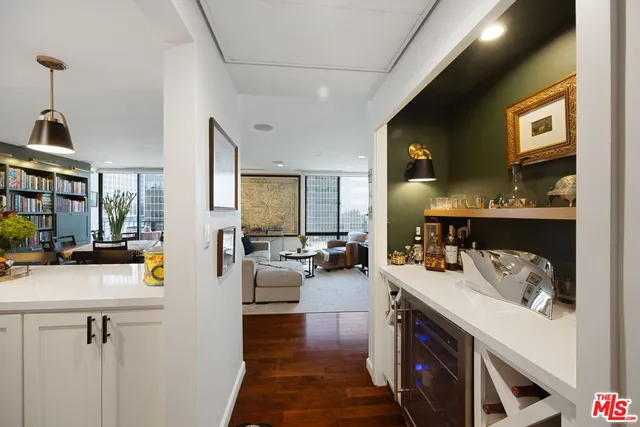 a view of living room with furniture and a flat screen tv