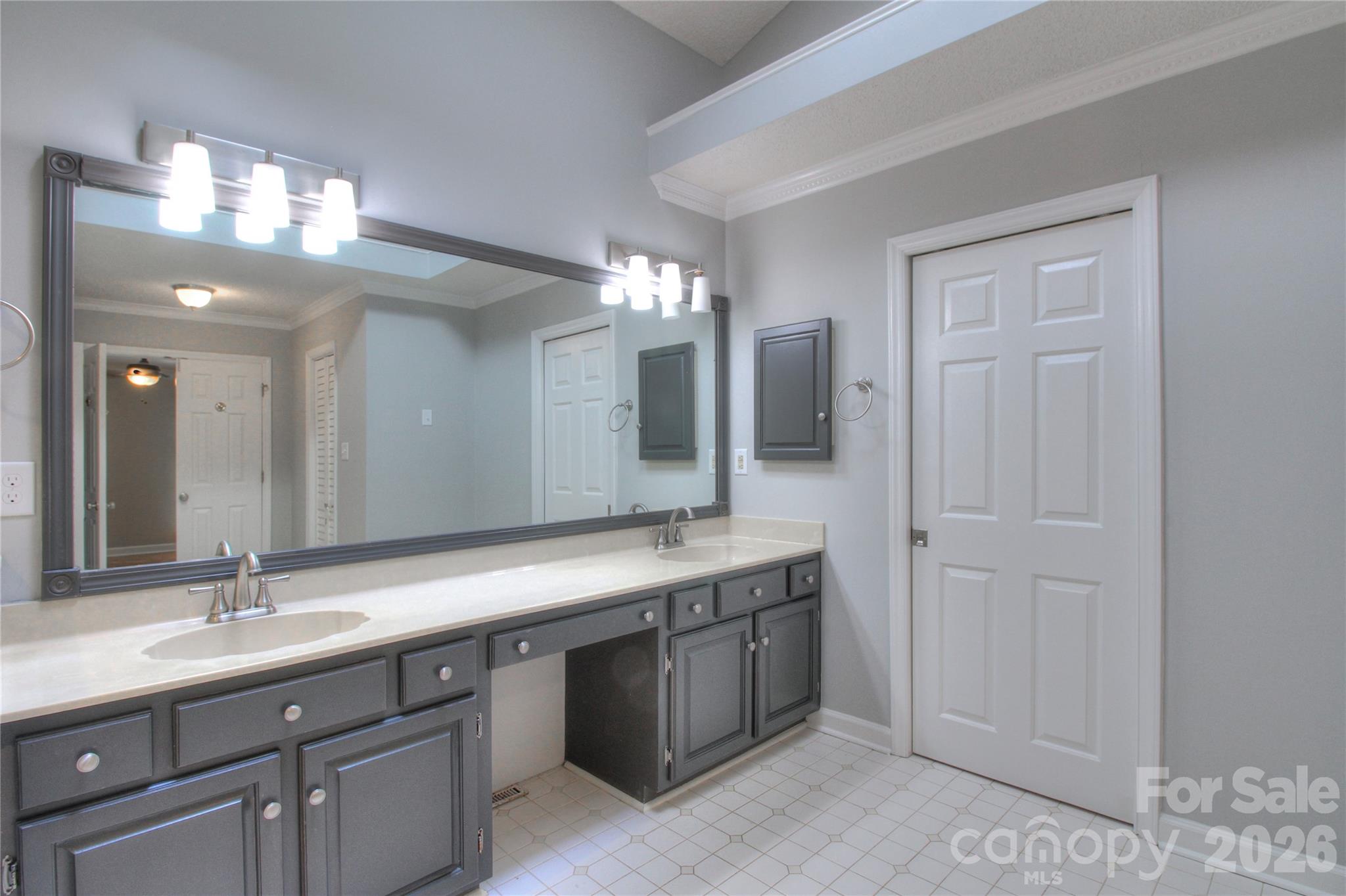 3408 Providence Manor Road Charlotte, NC 28270 - Photo 24 of 39 a bathroom with a double vanity sink and a mirror