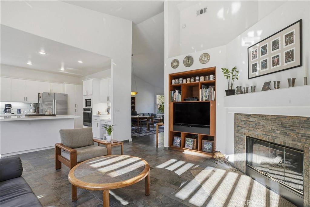 649 Asilo Arroyo Grande, CA 93420 - Photo 11 of 39 a living room with furniture a flat screen tv and a fireplace