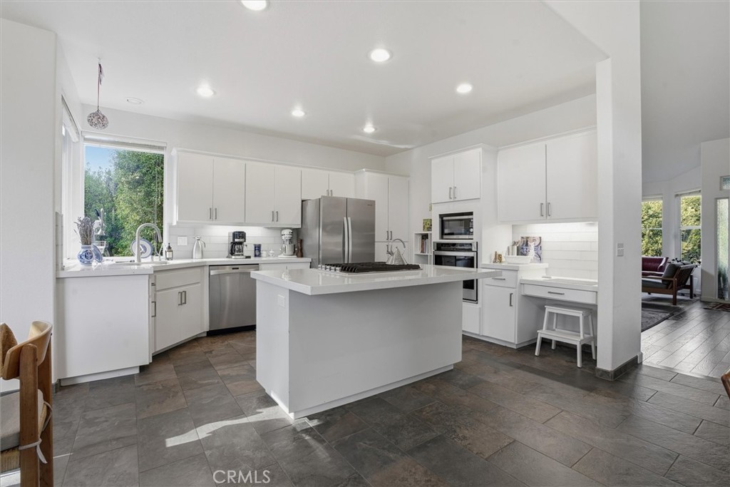 649 Asilo Arroyo Grande, CA 93420 - Photo 12 of 39 a kitchen with white cabinets and white appliances