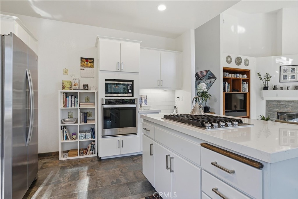 649 Asilo Arroyo Grande, CA 93420 - Photo 13 of 39 a kitchen with stainless steel appliances a sink and a refrigerator