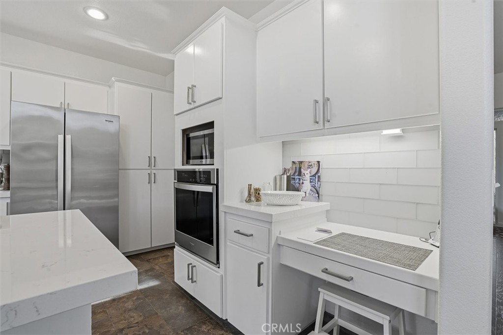 649 Asilo Arroyo Grande, CA 93420 - Photo 14 of 39 a kitchen with a refrigerator sink and cabinets