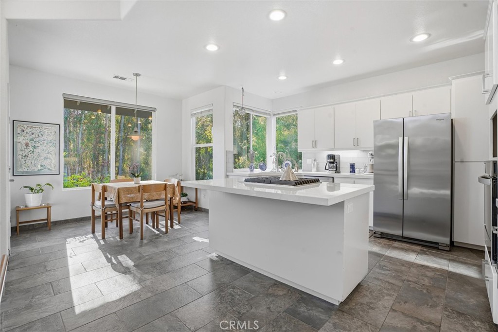 649 Asilo Arroyo Grande, CA 93420 - Photo 16 of 39 a kitchen with kitchen island a sink and refrigerator