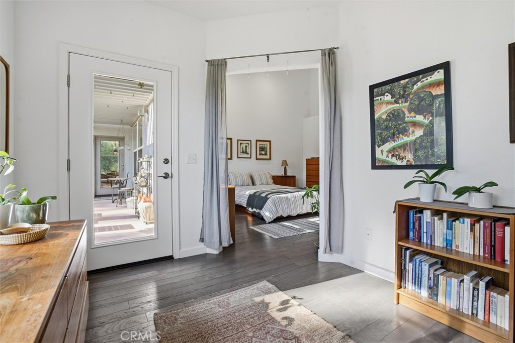649 Asilo Arroyo Grande, CA 93420 - Photo 21 of 39 a bedroom with furniture and a book shelf