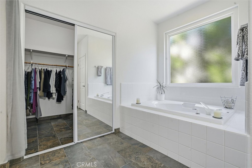 649 Asilo Arroyo Grande, CA 93420 - Photo 24 of 39 a en suite bathroom with a sink and a mirror