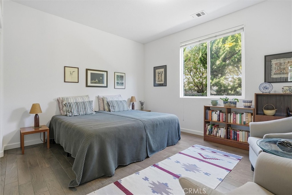 649 Asilo Arroyo Grande, CA 93420 - Photo 26 of 39 a bedroom with a large bed and a window