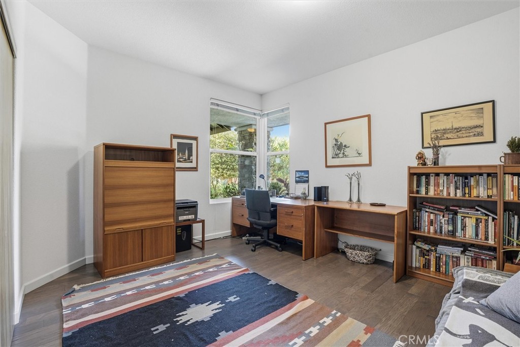 649 Asilo Arroyo Grande, CA 93420 - Photo 29 of 39 a room with furniture a bookshelf and a window