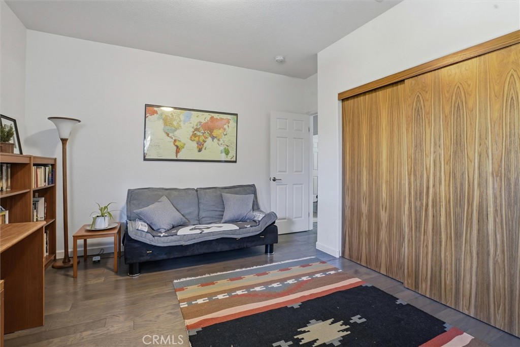 649 Asilo Arroyo Grande, CA 93420 - Photo 30 of 39 a living room with furniture and a bookshelf