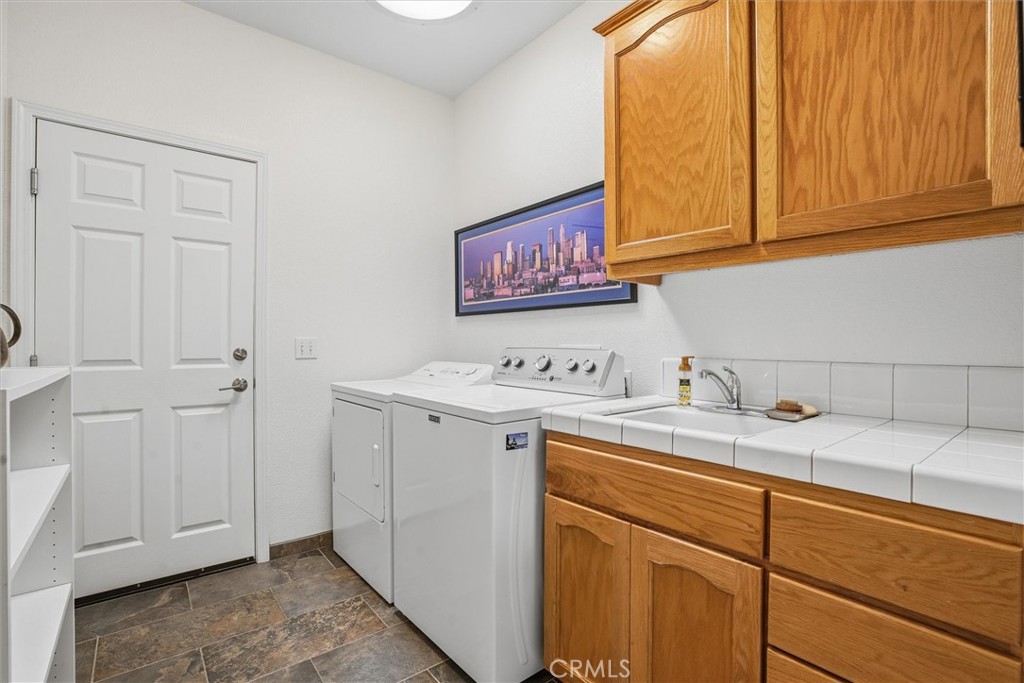 649 Asilo Arroyo Grande, CA 93420 - Photo 31 of 39 a view of a storage and utility room with a sink
