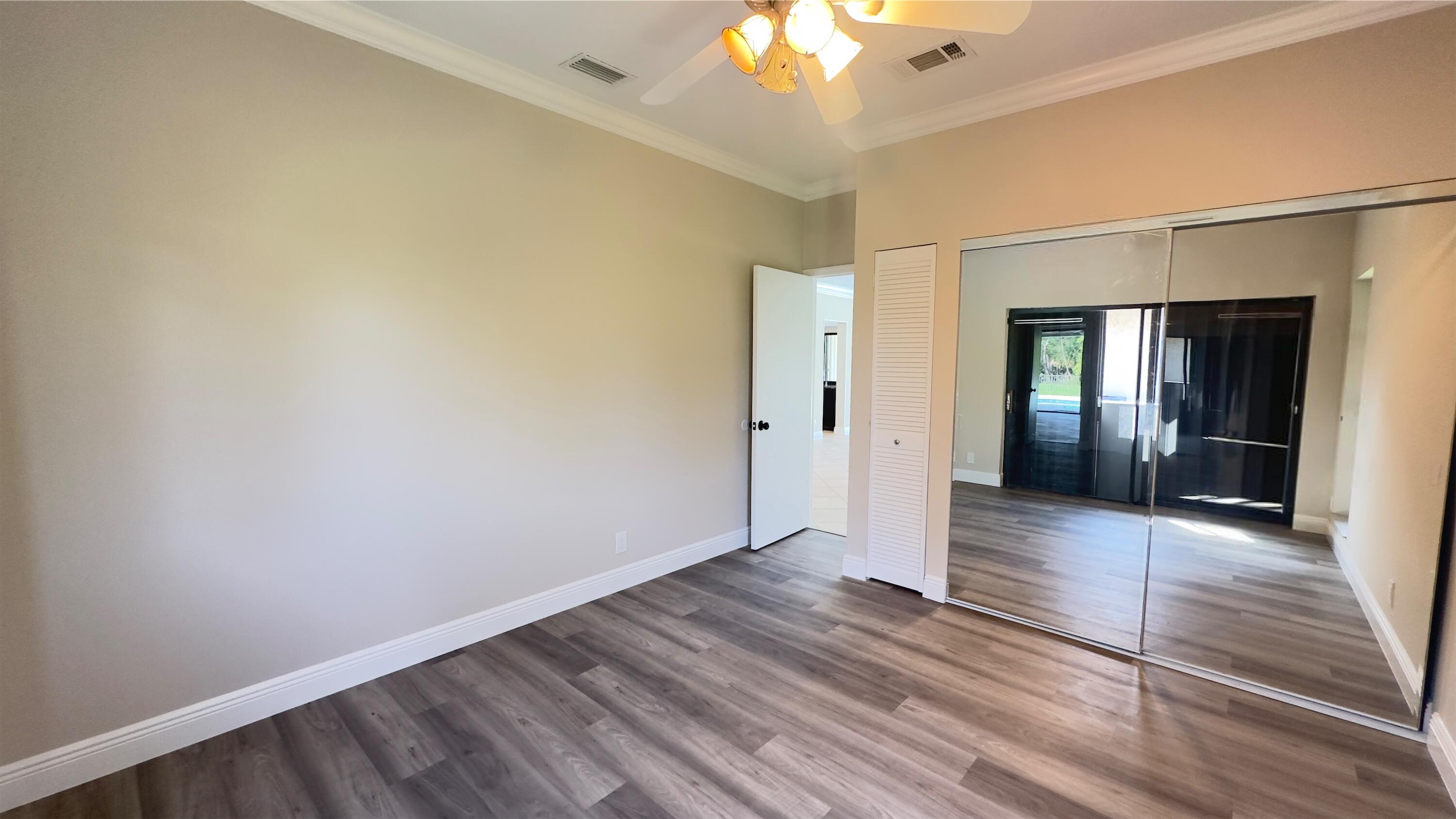 11330 Timber Lodge Terrace Boca Raton, FL 33428 - Photo 12 of 23 a view of a hallway with wooden floor