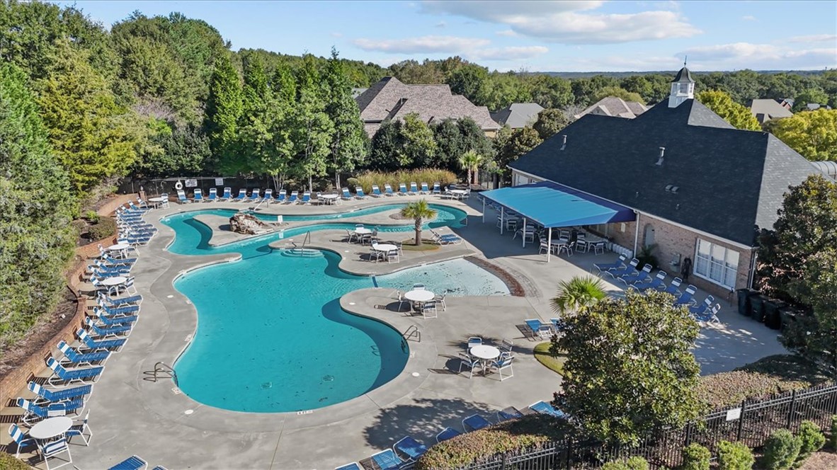 105 Bree Drive Anderson, SC 29621 - Photo 43 of 48 The community pool, surrounded by lush greenery, offers a refreshing oasis with ample space for leisure and social gatherings.