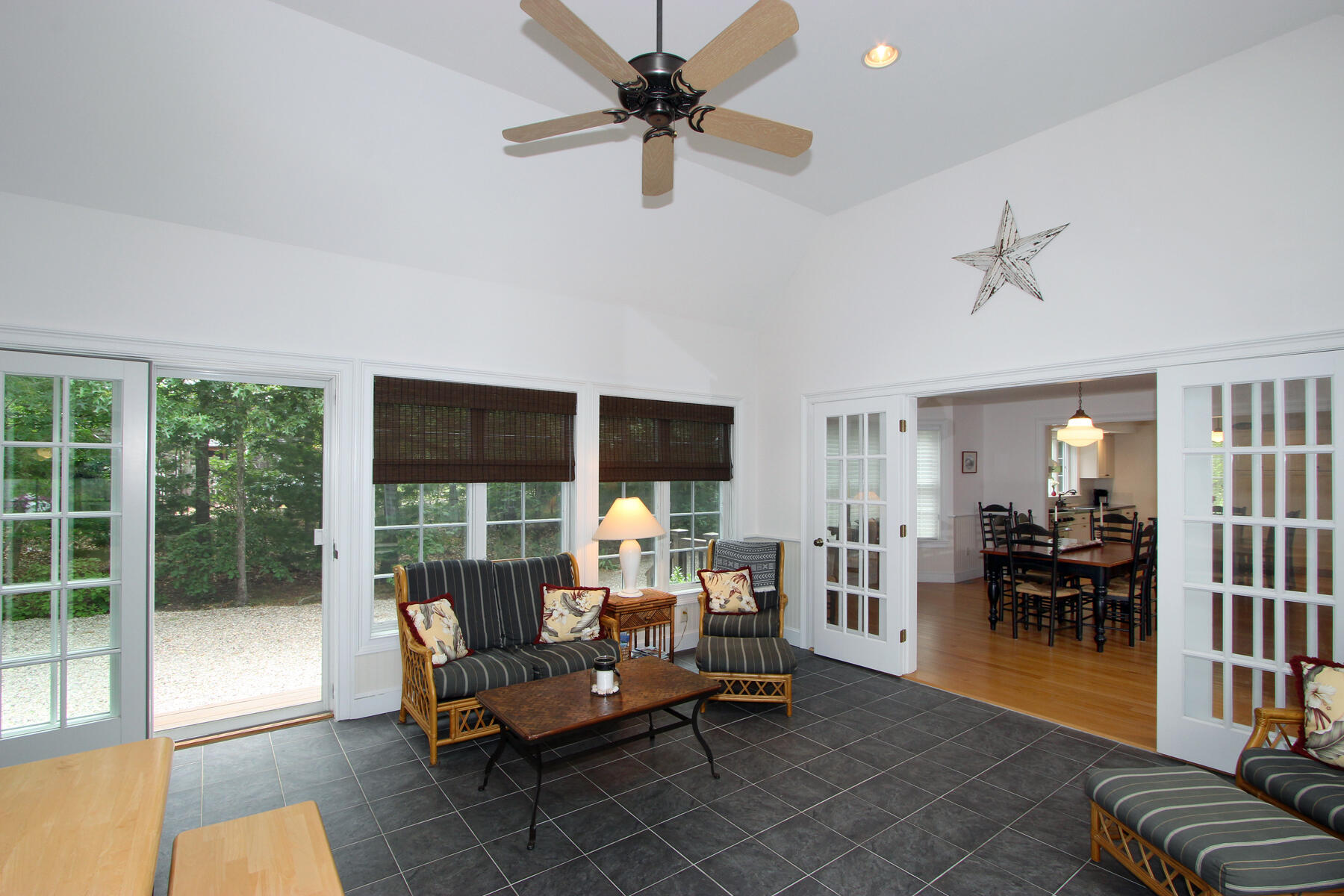 195 Cathedral Road Brewster, MA 02631 - Photo 23 of 54 a living room with furniture and a large window with wooden floor