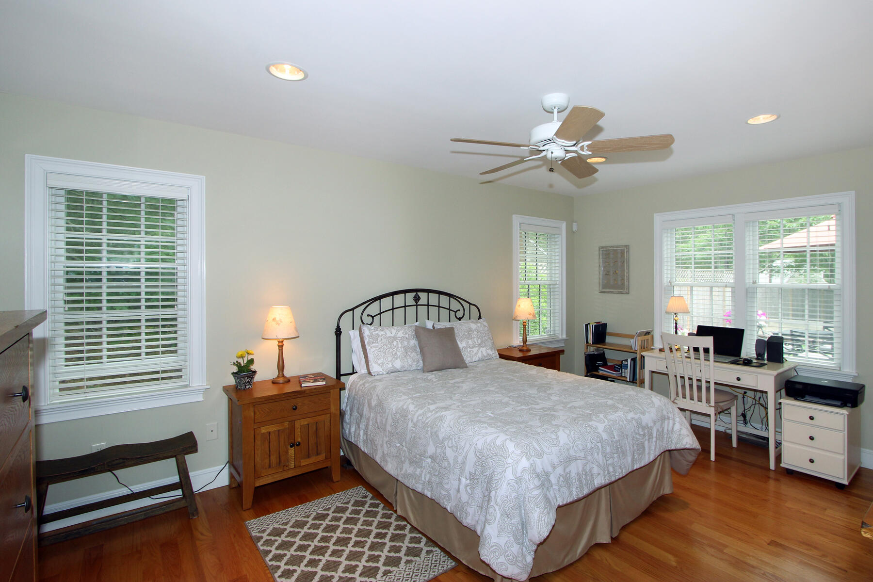 195 Cathedral Road Brewster, MA 02631 - Photo 25 of 54 a bedroom with a bed and a chandelier