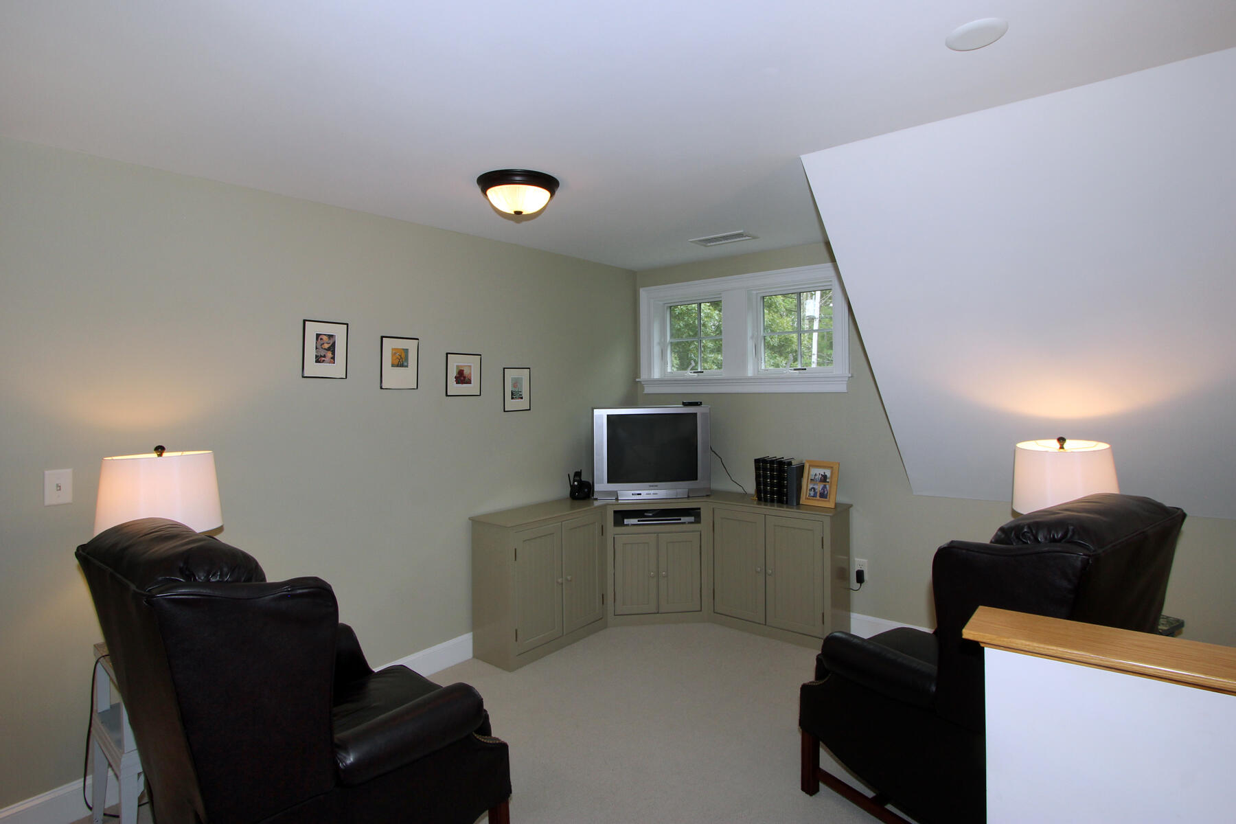 195 Cathedral Road Brewster, MA 02631 - Photo 29 of 54 a living room with furniture and a flat screen tv