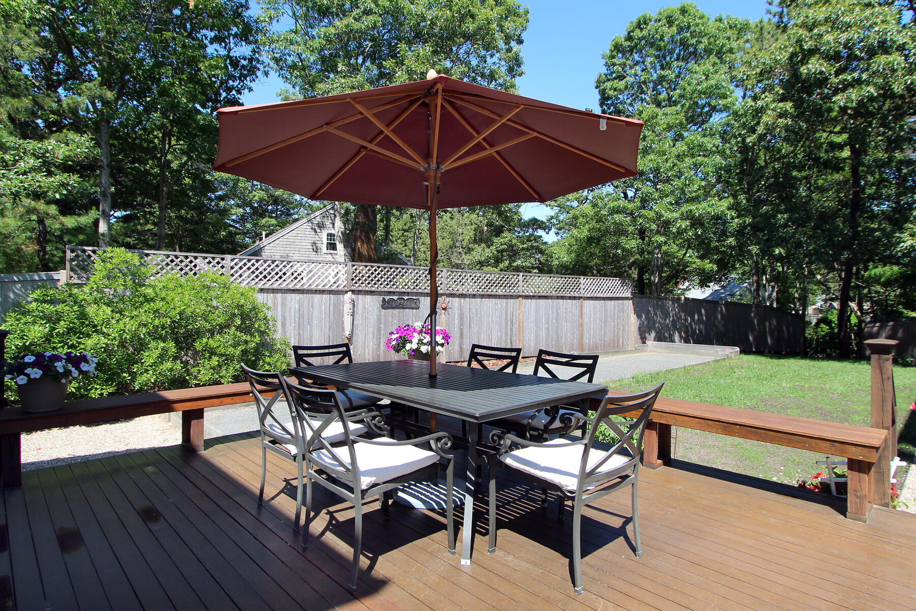 195 Cathedral Road Brewster, MA 02631 - Photo 3 of 54 a view of backyard with seating space and wooden fence