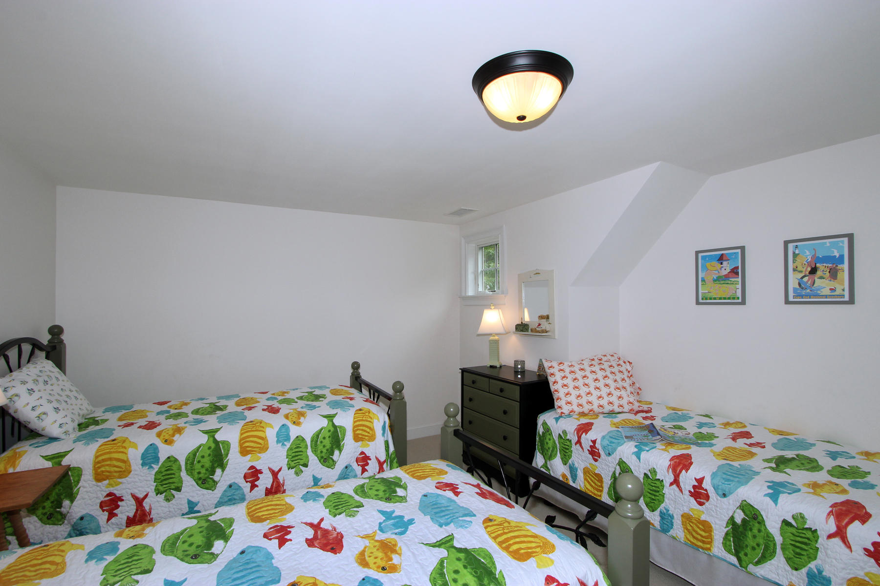 195 Cathedral Road Brewster, MA 02631 - Photo 32 of 54 a bedroom with a bed and a lamp on dresser
