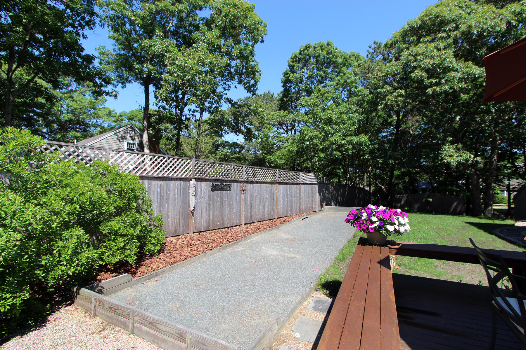 195 Cathedral Road Brewster, MA 02631 - Photo 6 of 54 a view of a chairs and table on the wooden floor