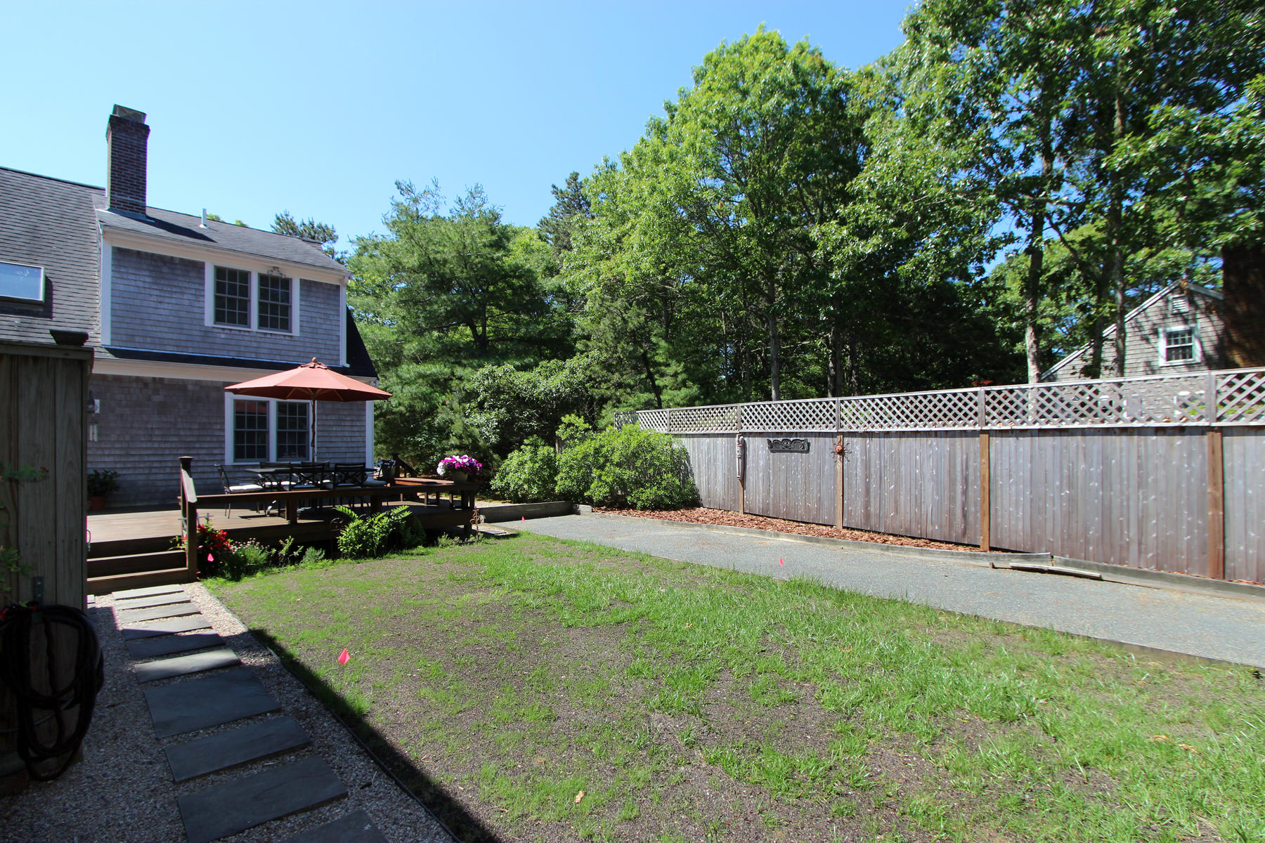 195 Cathedral Road Brewster, MA 02631 - Photo 10 of 54 a view of a house with backyard and sitting area