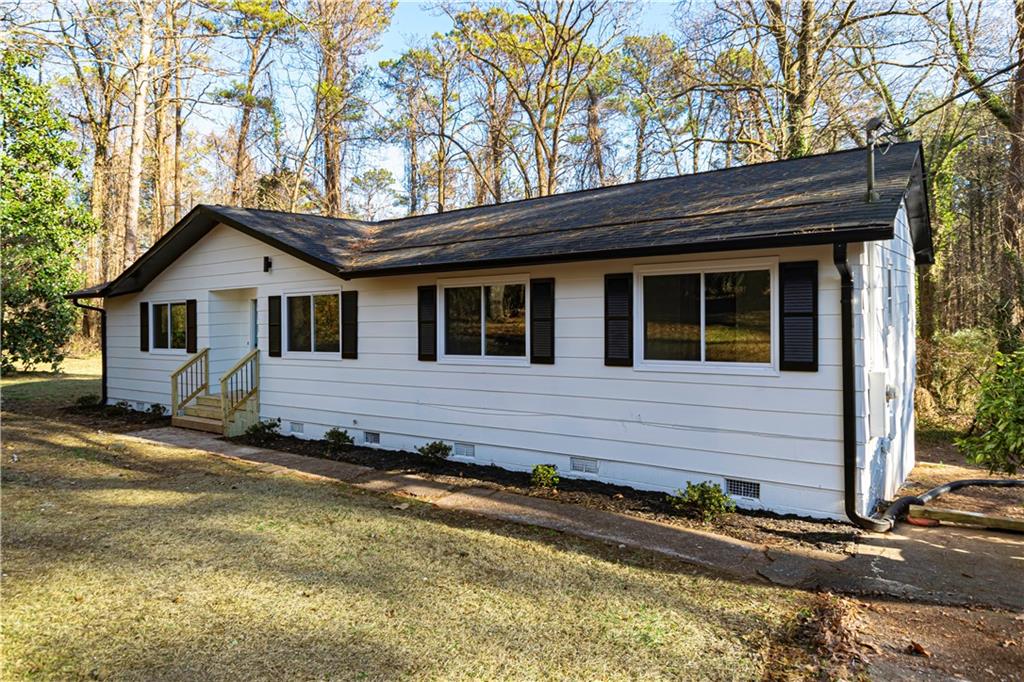 940 Porter Road Decatur, GA 30032 - Photo 1 of 1 a front view of a house with a yard