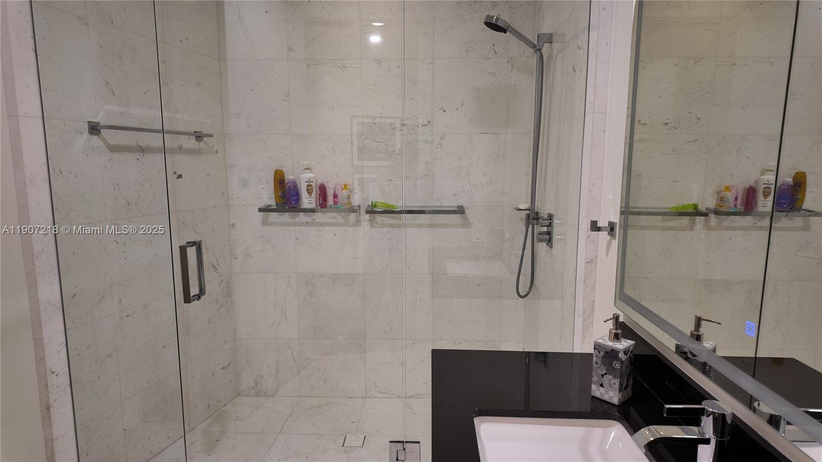 18555 Collins Avenue, Unit 905 Sunny Isles Beach, FL 33160 - Photo 15 of 38 a bathroom with a shower