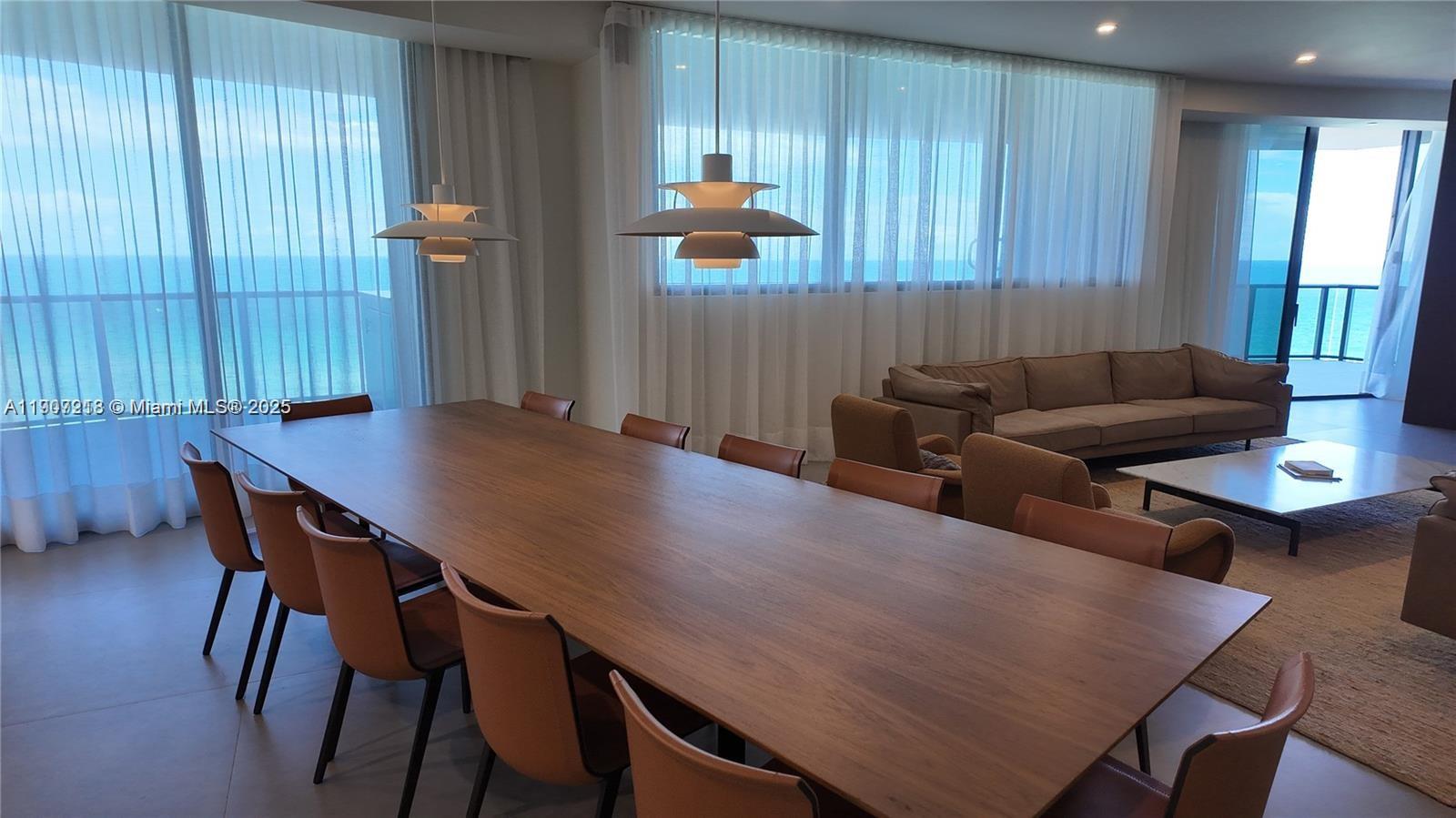 18555 Collins Avenue, Unit 905 Sunny Isles Beach, FL 33160 - Photo 25 of 38 a living room with furniture and wooden floor