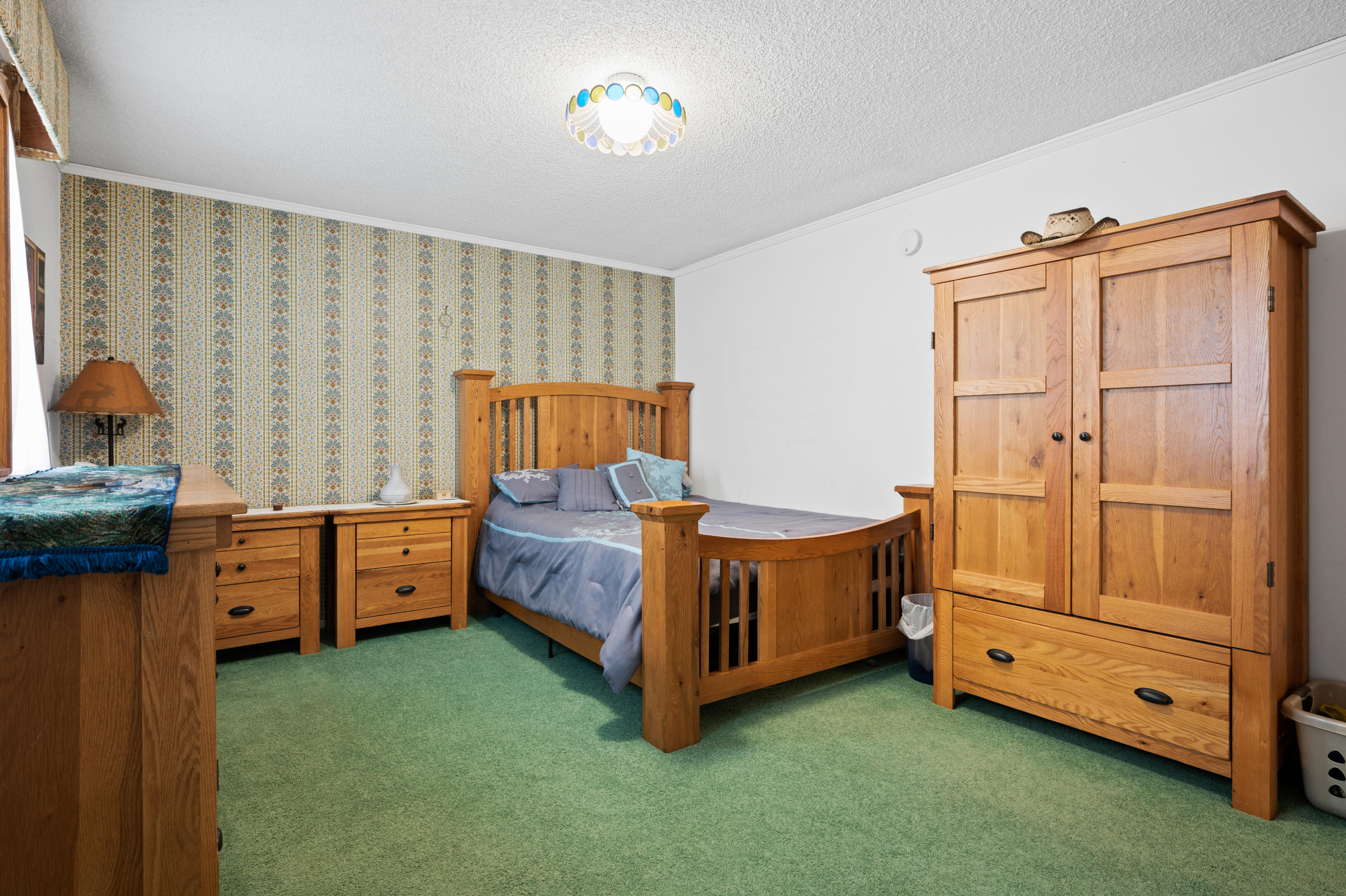 3432 Rucker Road Lompoc, CA 93436 - Photo 9 of 17 a bed room with a bed and a dresser