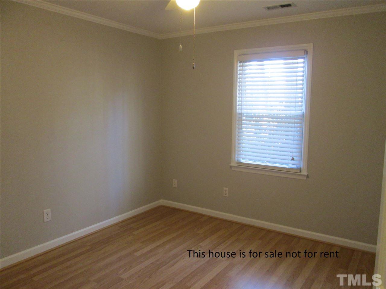 5513 Hamstead Crossing Raleigh, NC 27612 - Photo 22 of 30 an empty room with wooden floor and windows