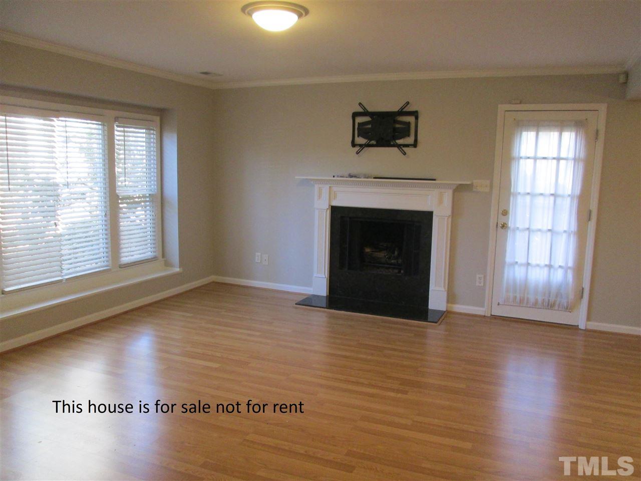 5513 Hamstead Crossing Raleigh, NC 27612 - Photo 5 of 30 a view of an empty room with window and fire place