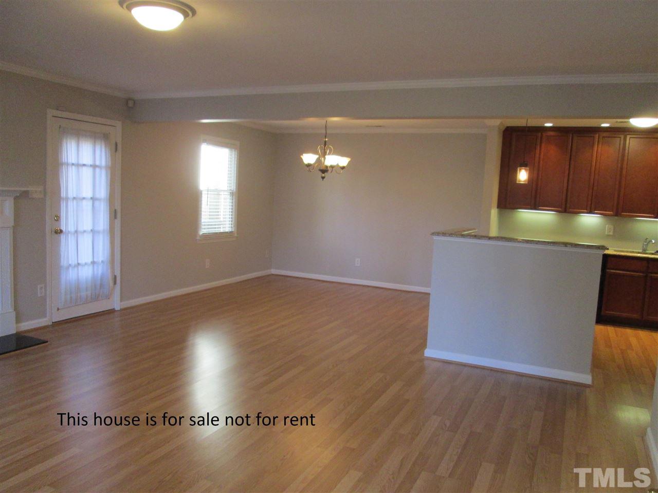 5513 Hamstead Crossing Raleigh, NC 27612 - Photo 8 of 30 an empty room with wooden floor and windows