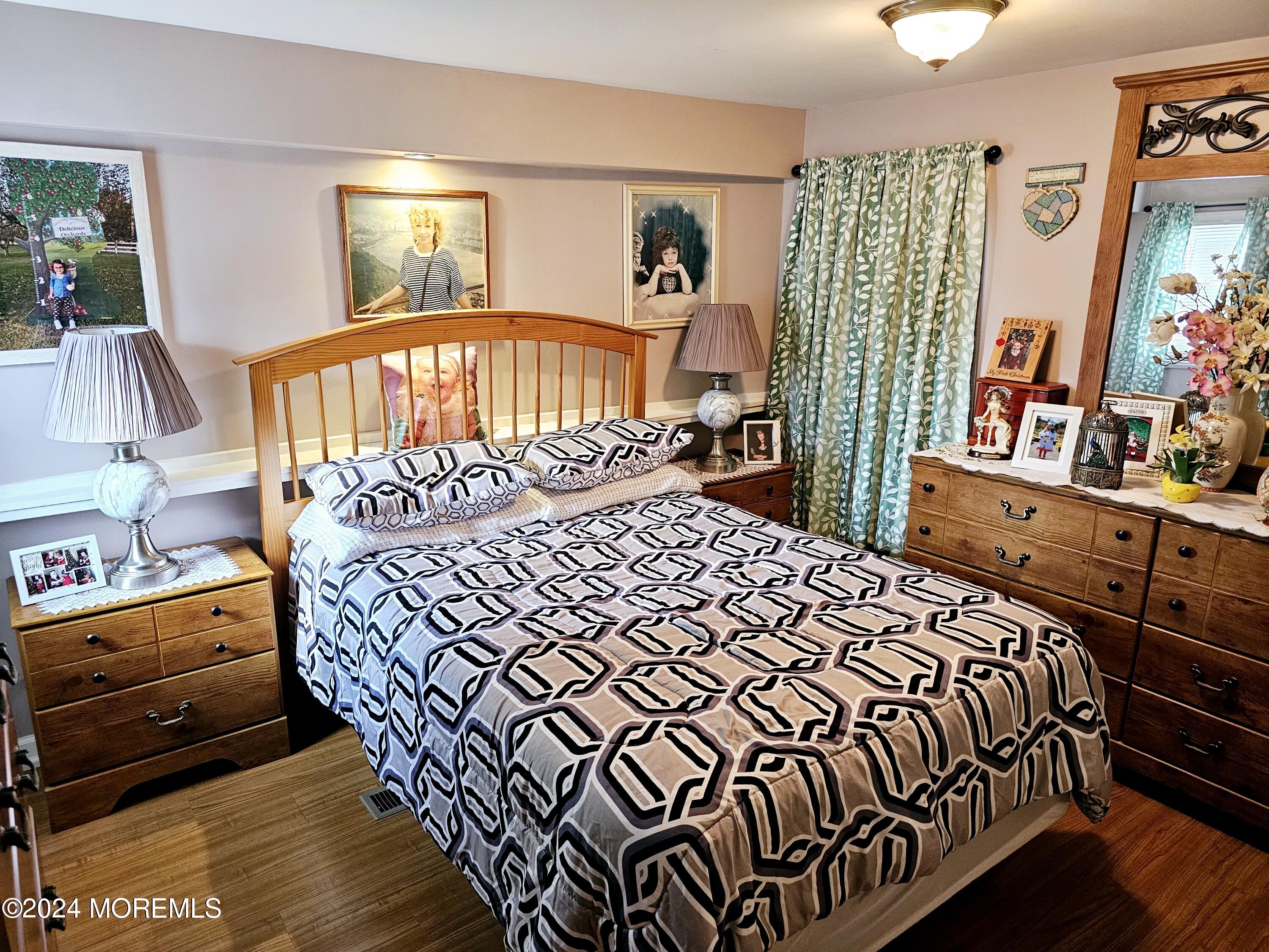 5 Kane Lane Middletown, NJ 07748 - Photo 12 of 23 a bedroom with a bed and a dresser in it