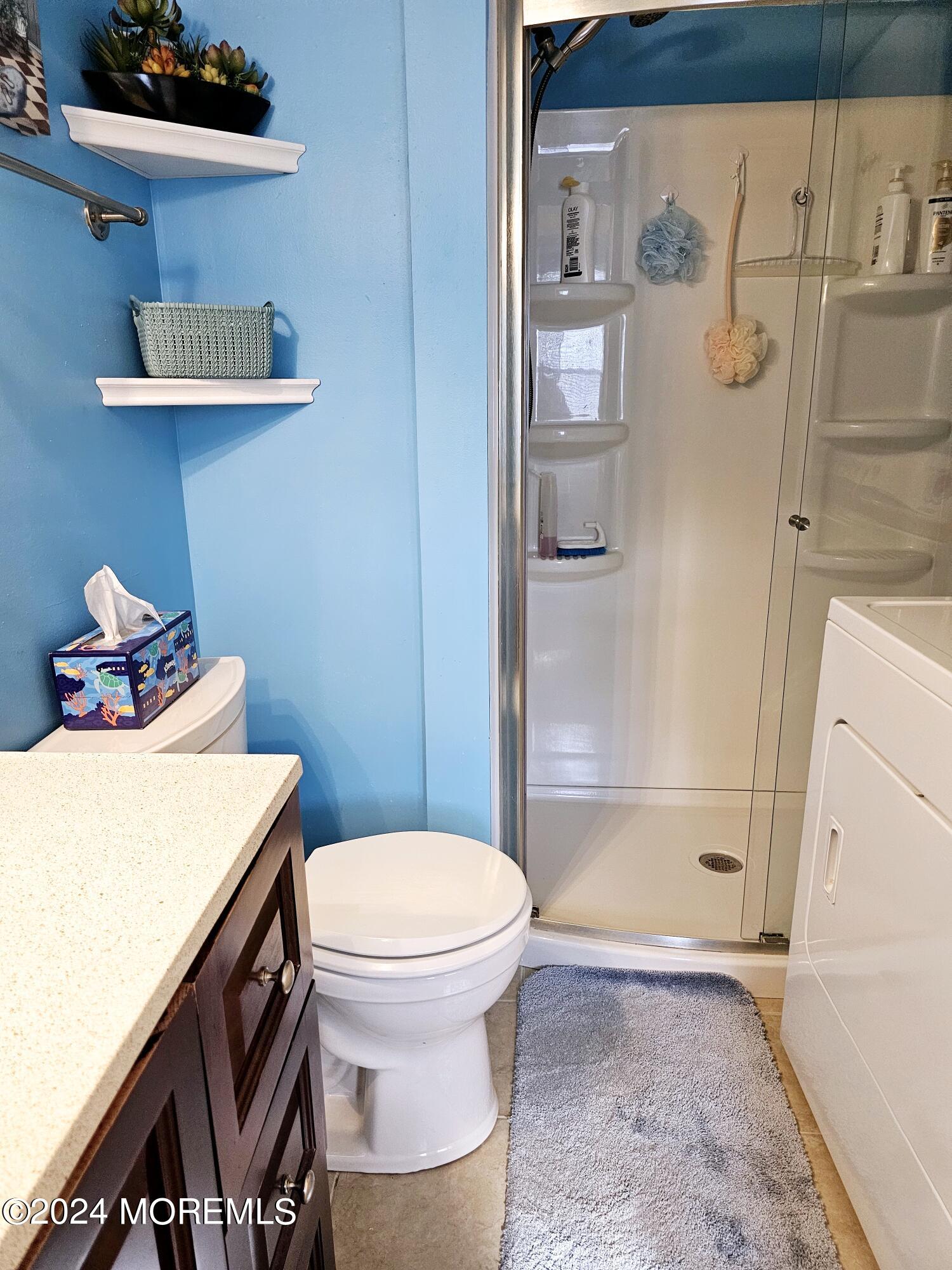 5 Kane Lane Middletown, NJ 07748 - Photo 18 of 23 a bathroom with a sink a toilet and shower