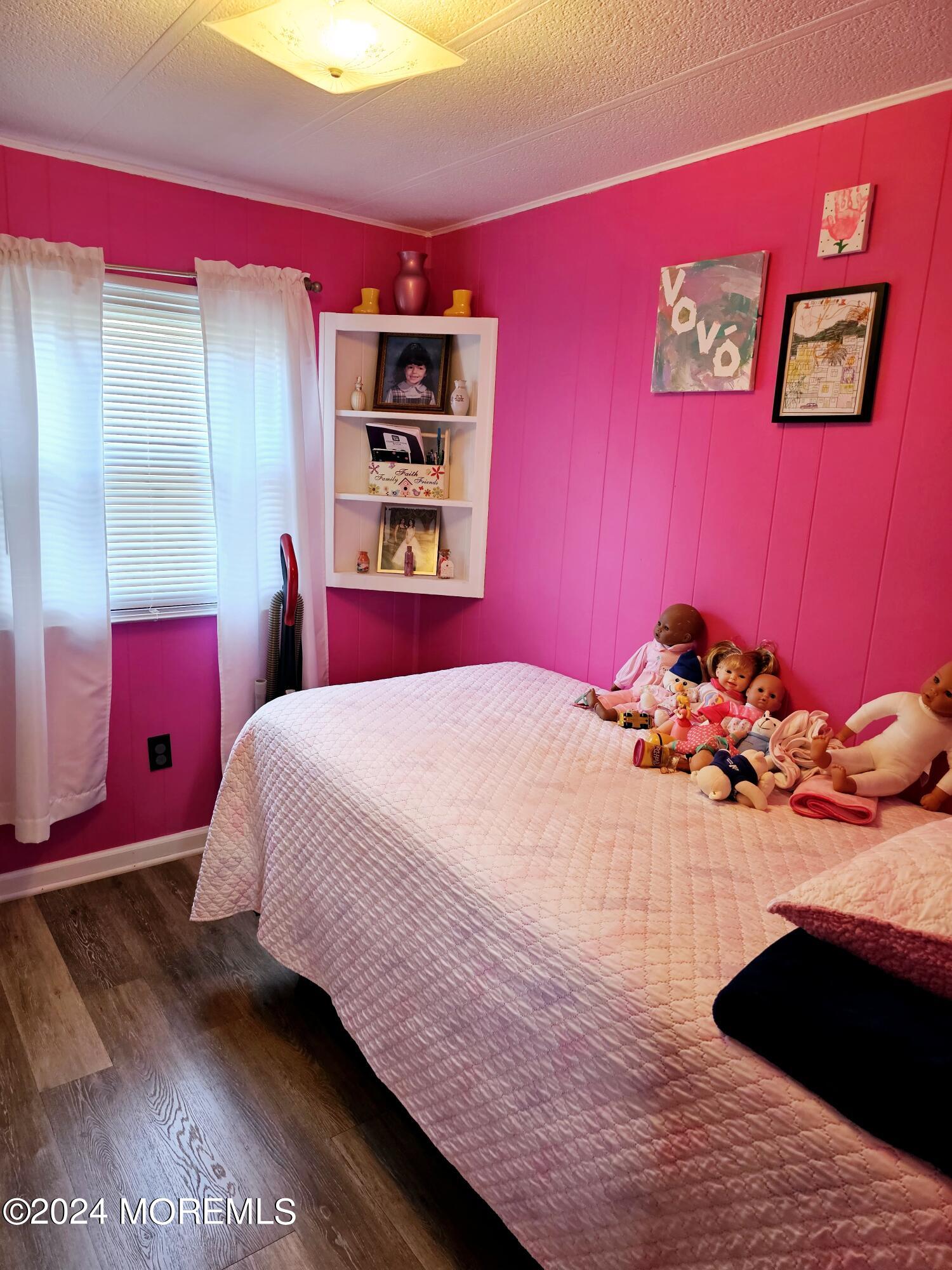 5 Kane Lane Middletown, NJ 07748 - Photo 20 of 23 a bedroom with a bed and a chandelier