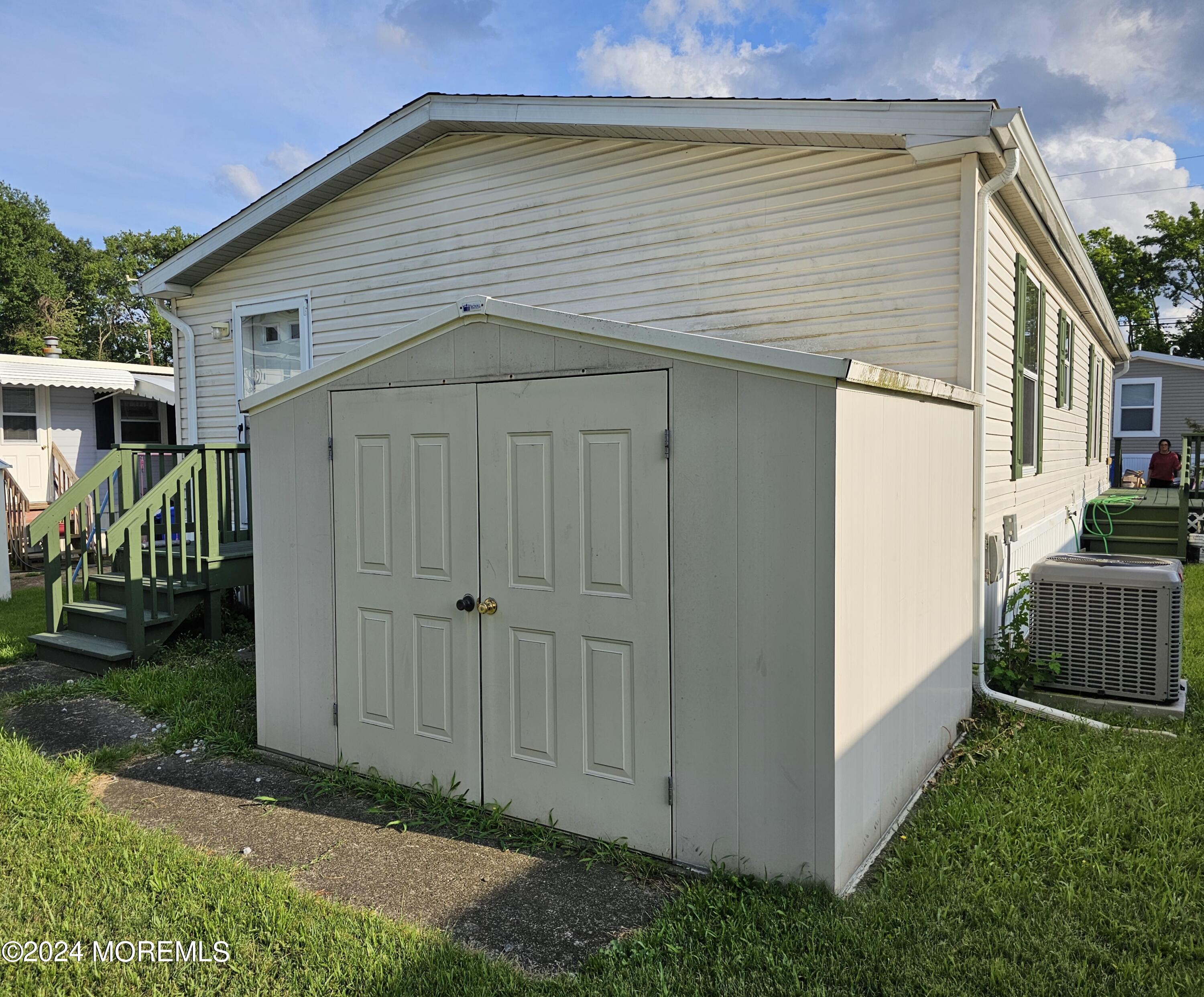5 Kane Lane Middletown, NJ 07748 - Photo 23 of 23 a front view of a house with garden