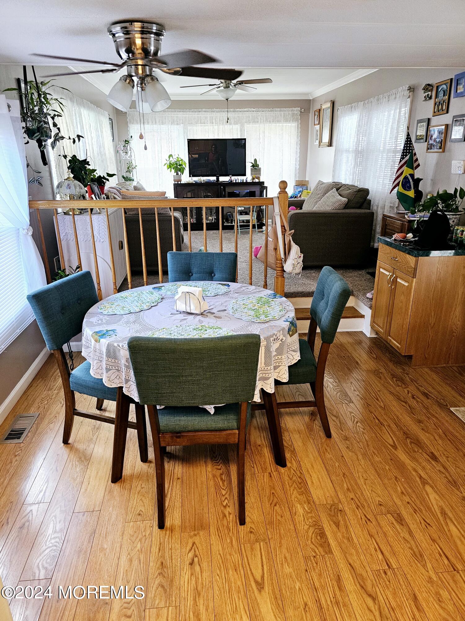 5 Kane Lane Middletown, NJ 07748 - Photo 9 of 23 a living room with furniture and a wooden floor