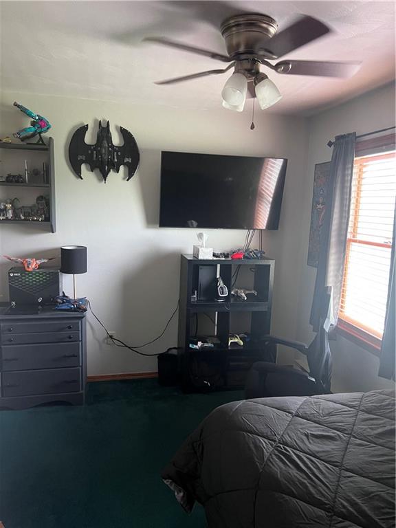 226 Hogback Road Kersey, PA 15846 - Photo 17 of 45 a bedroom with a bed and a chandelier fan