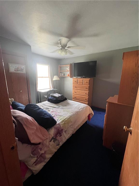 226 Hogback Road Kersey, PA 15846 - Photo 19 of 45 a bedroom with a bed and wooden floor